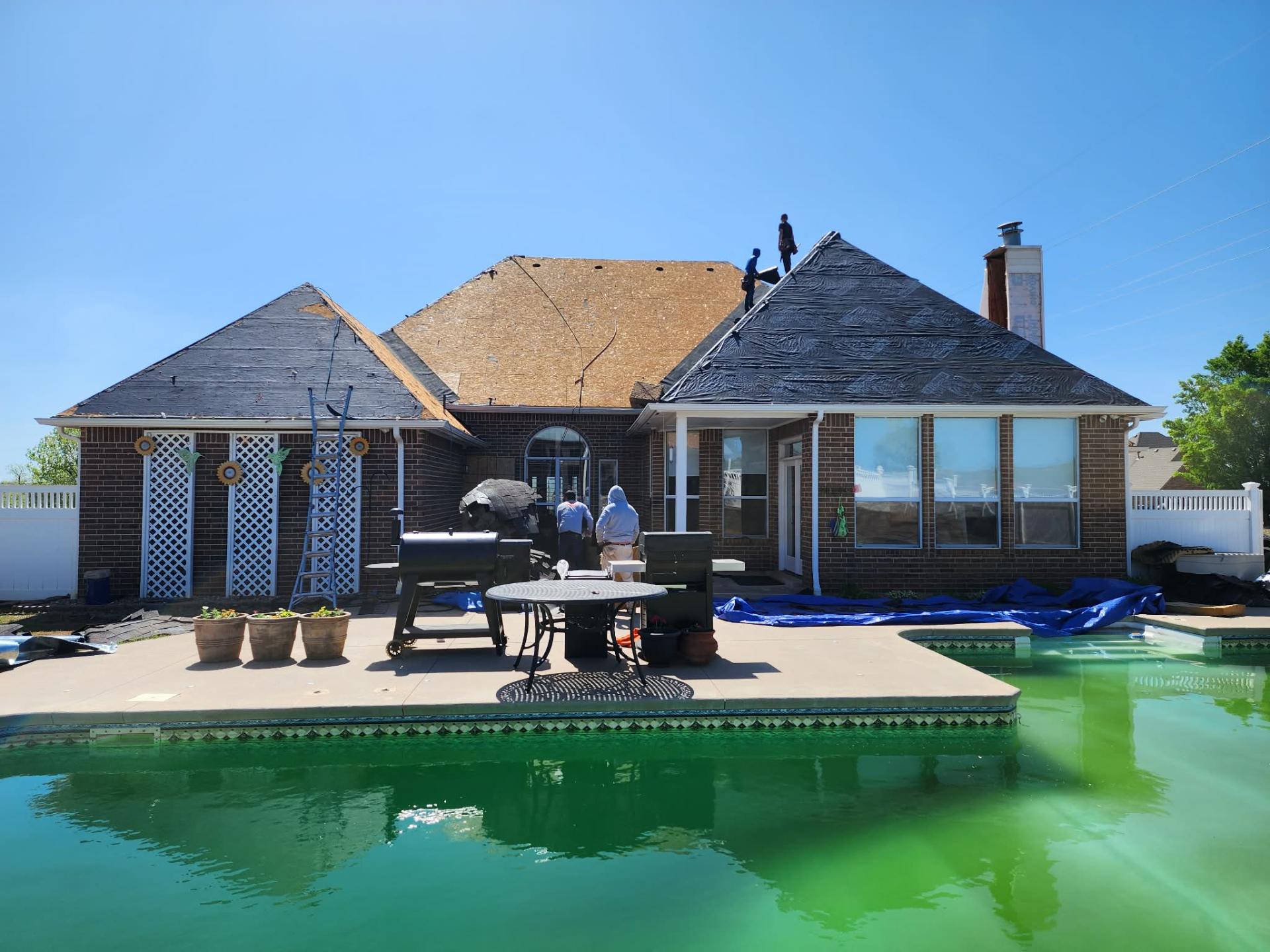 Decking and underlayment progress β backyard view by pool